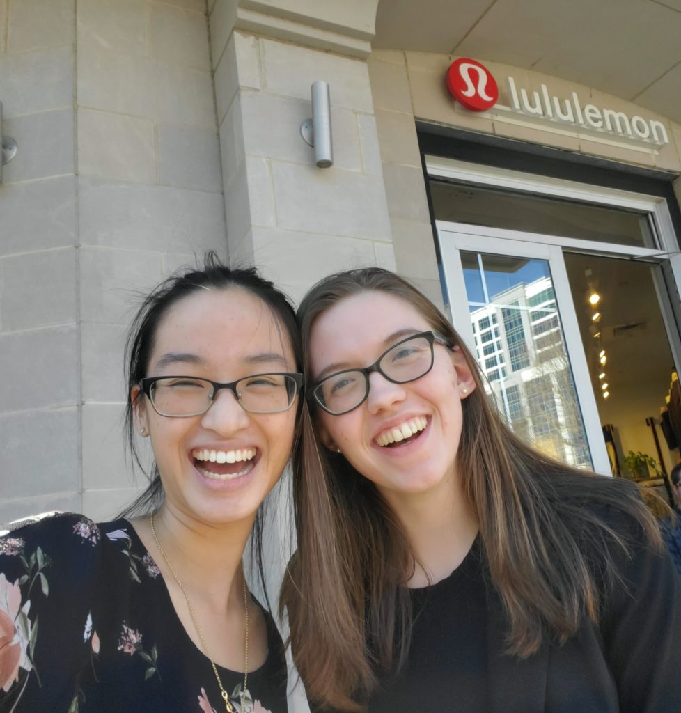 selfie of 2 girls in front of lululemon storefront in downtown Greenville SC