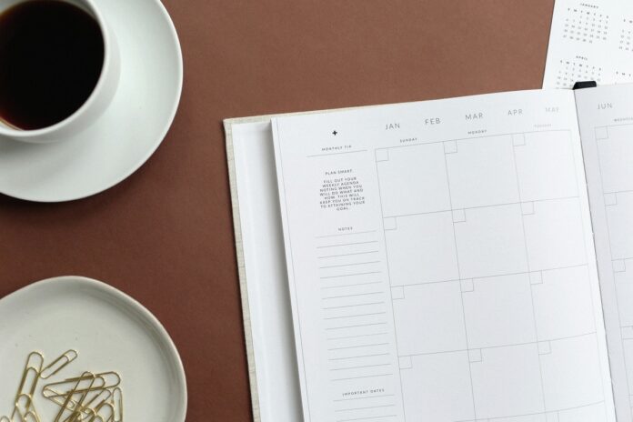 planner on table with coffee